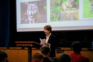 Woman in auditorium.